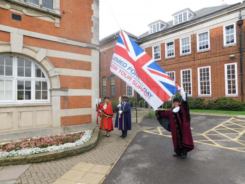 The Worshipful Mayor of Barnet, Councillor Caroline Stock, and Deputy Mayor, Councillor Lachhya Bahadur Gurung, raise the Armed Forces flag outside the Town Hall for Armed Forces Week.