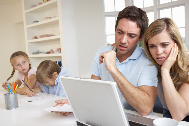 Concerned family looking at a laptop