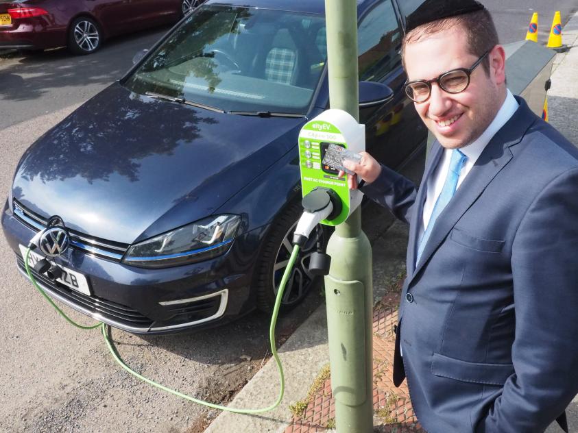 •	Councillor Dean Cohen, Chair of the Environment Committee, tests out one of our new charging points