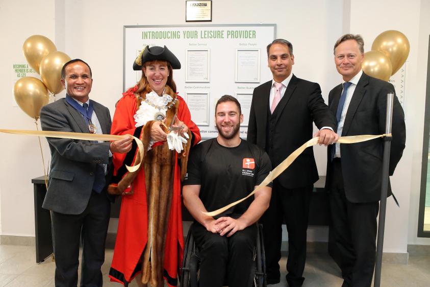 The Worshipful Mayor of Barnet, Councillor Caroline Stock, cuts the ribbon to officially open Barnet Copthall Leisure Centre.