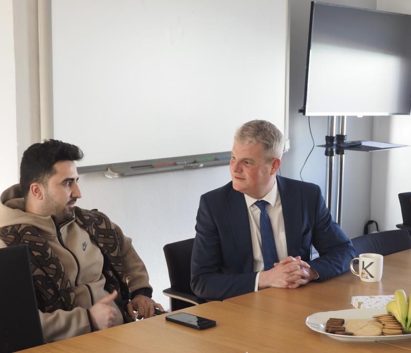 Government minister Stuart Andrew meets a care leaver on a visit to the Onwards and Upwards hub