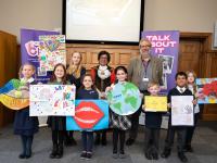 The pupils, with their winning posters, are congratulated by the Worshipful Mayor of Barnet, Cllr Nagus Narenthira, and Chris Munday, Executive Director of Children Services 