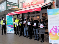 Cllrs, with police and council officers, with My Caffe owner outside My Caffe